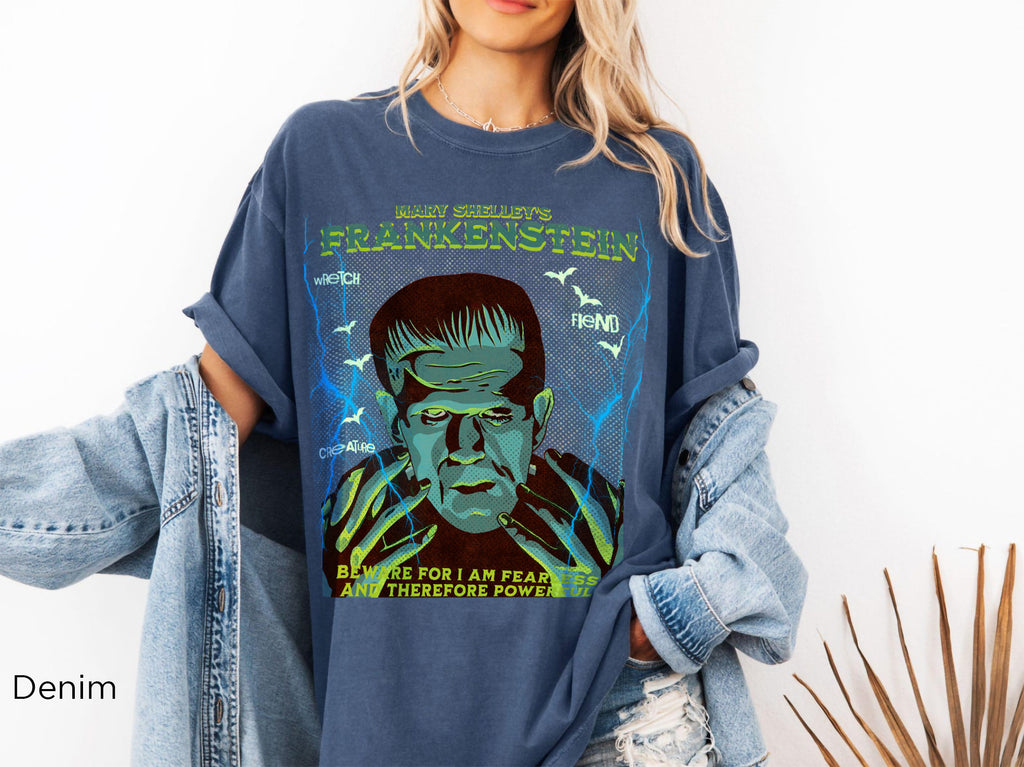 Denim: Blue Jean-colored Frankenstein gothic tee with vintage-inspired monster illustration and classic horror design