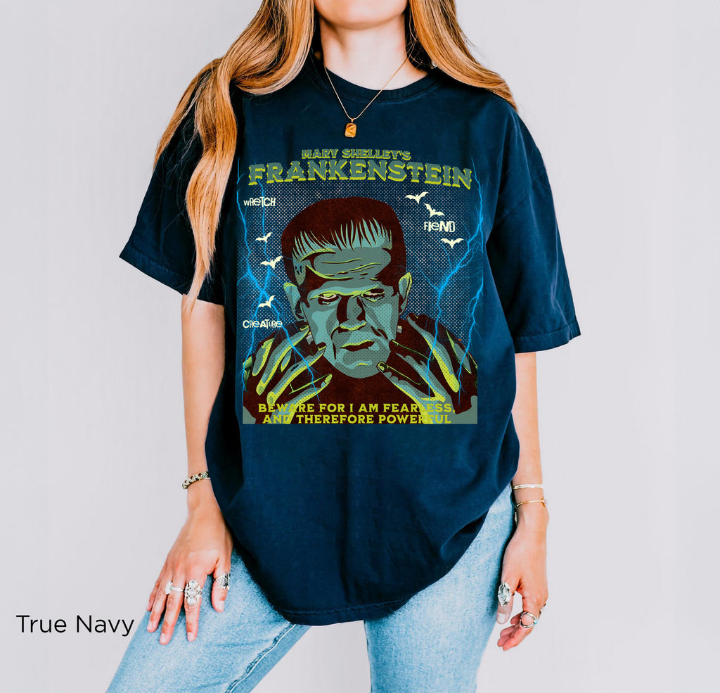 True Blue: Frankenstein graphic t-shirt in True Blue featuring Mary Shelley, gothic horror artwork, bats and lightning