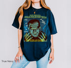 True Blue: Frankenstein graphic t-shirt in True Blue featuring Mary Shelley, gothic horror artwork, bats and lightning