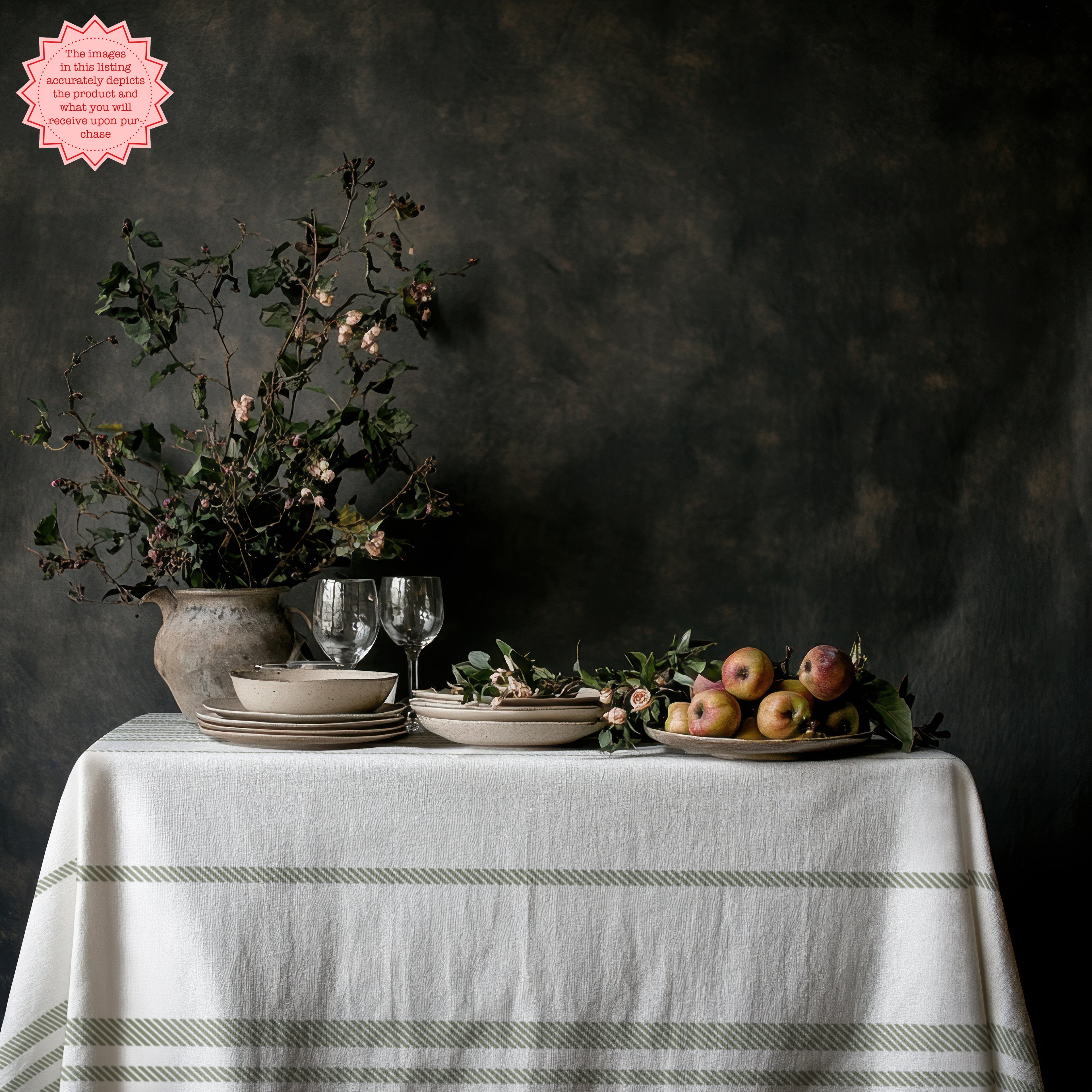 Sage green striped tablecloth creating an elegant European-inspired tablescape with white ceramics and natural décor.