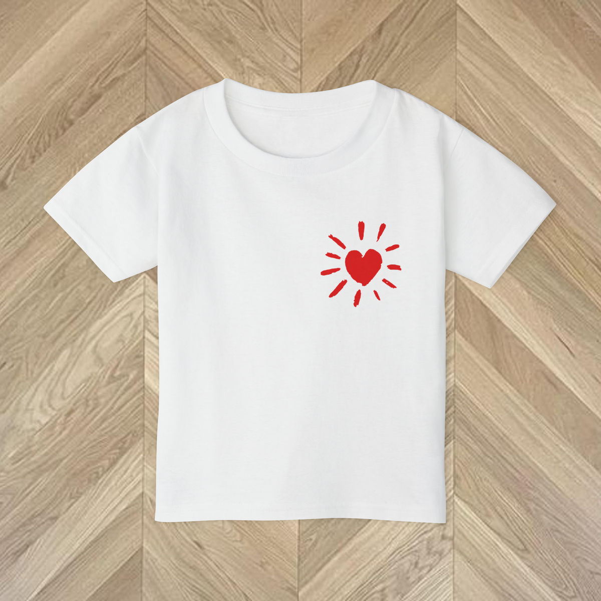 Close-up of the vibrant More Amore Por Favour with colourful heart to the front of the tee