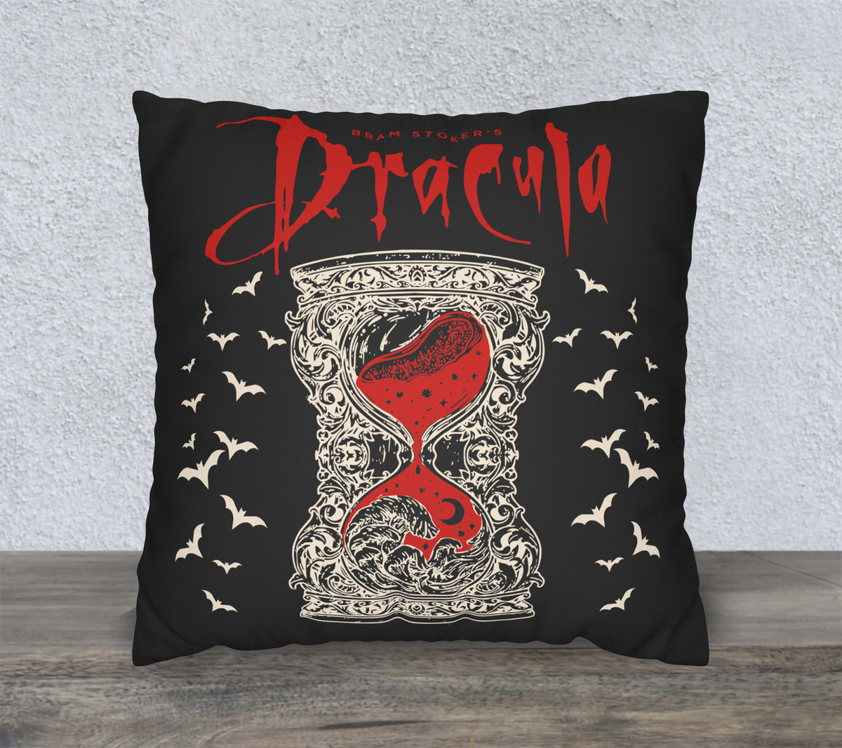 Dracula faux suede pillow cover featuring a red hourglass and ornate ivory gothic artwork on a black background.