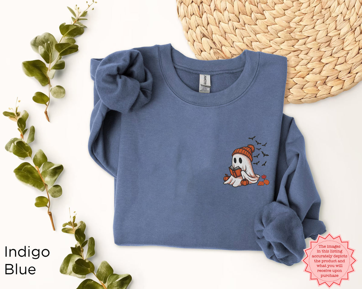 Ghost Reader Halloween crewneck sweatshirt displayed flat with embroidered ghost book design and cozy fall accessories