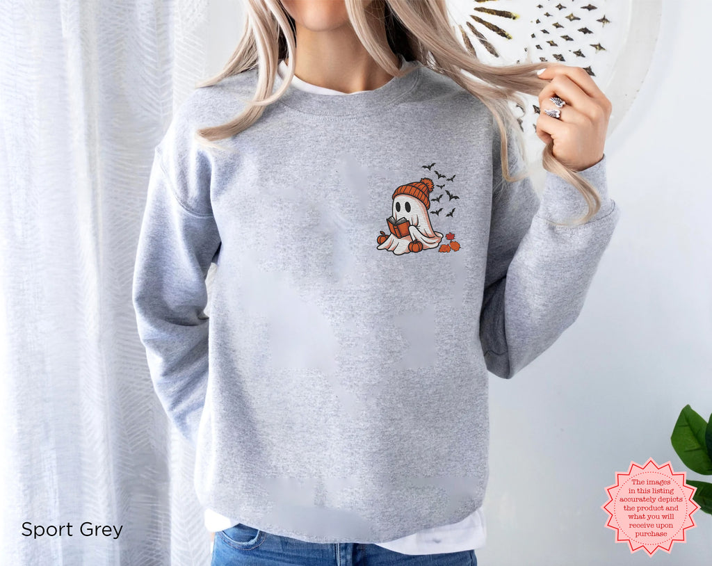 Minimal embroidered Halloween crewneck sweatshirt featuring a book loving ghost with pumpkin and autumn accents
