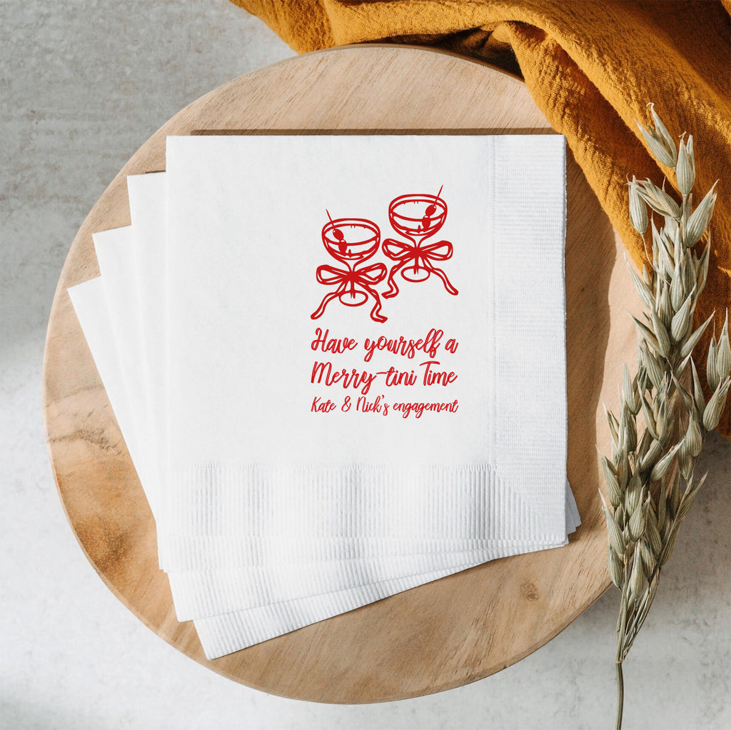 Personalized Christmas martini napkin featuring festive artwork with custom name and event date for a holiday cocktail party.