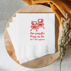 Personalized Christmas martini napkin featuring festive artwork with custom name and event date for a holiday cocktail party.