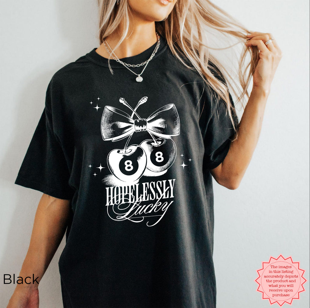 Retro-inspired "Hopelessly Lucky" cherry graphic tee, perfect for a bold summer look.