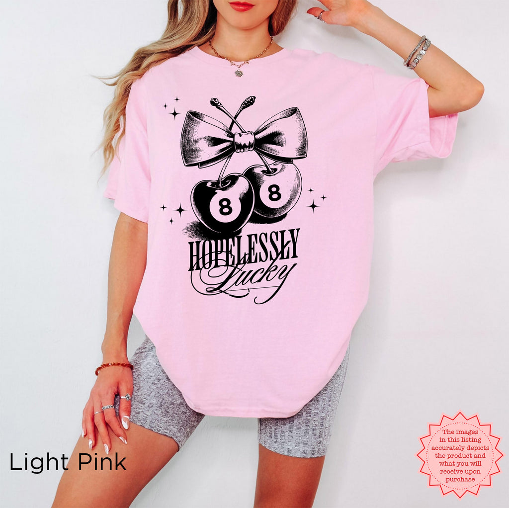 Cute and trendy cherry graphic tee with vintage "Hopelessly Lucky" design.