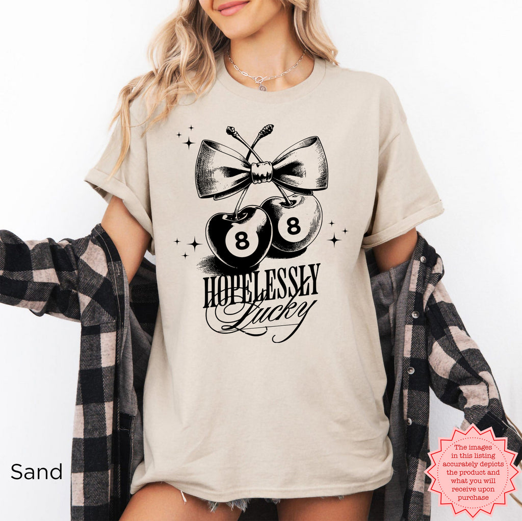 Trendy cherry graphic with "Hopelessly Lucky" text, perfect for adding a retro touch to your wardrobe.