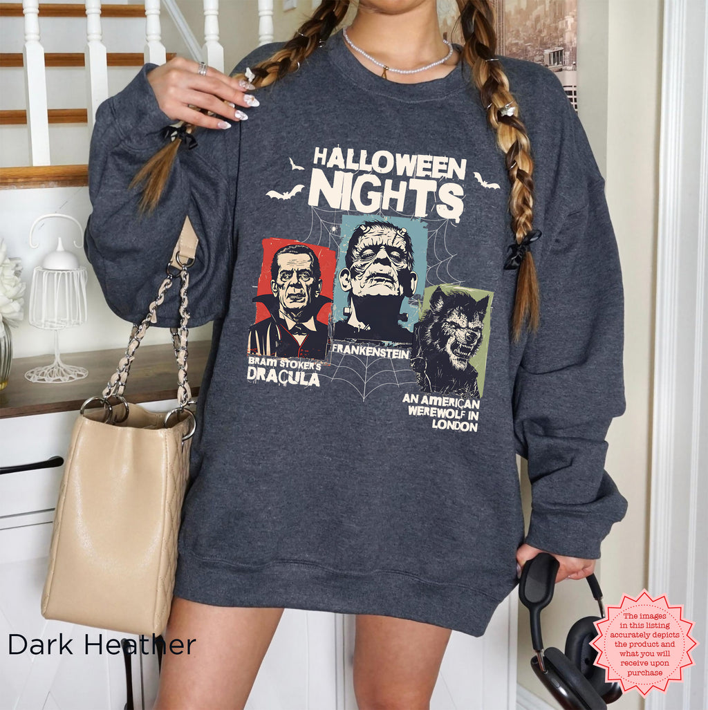 Horror Nights Halloween graphic crewneck in Dark Heather featuring three illustrated horror movie characters and bold Halloween Nights text.