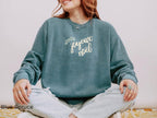 Relaxed-fit Joyeux Noël Christmas crewneck paired with casual denim for an effortless women's holiday outfit