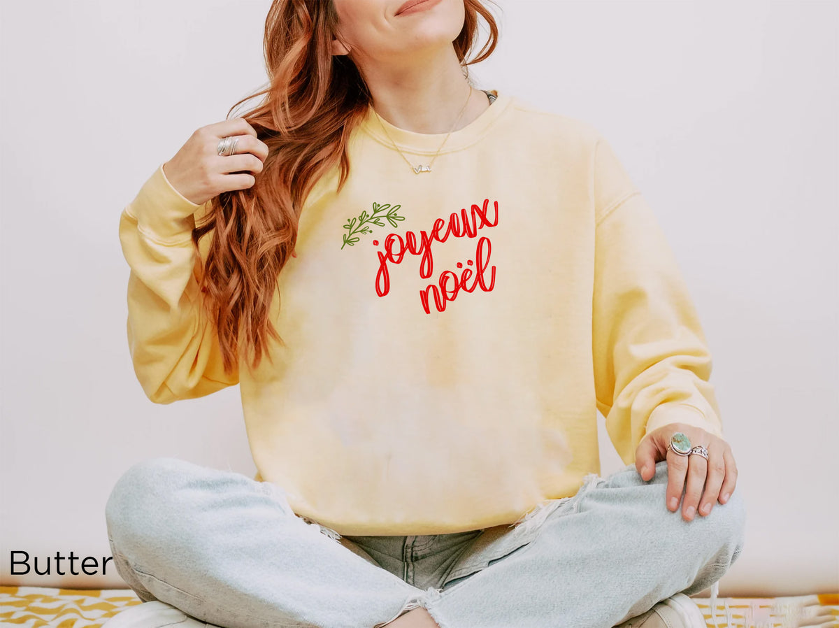 French-inspired Joyeux Noël sweatshirt from REBBELLA styled as a thoughtful Christmas gift for her