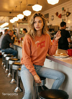 Comfort Colors 1566 Christmas crewneck in Terracotta featuring red Joyeux Noël lettering and a delicate botanical design