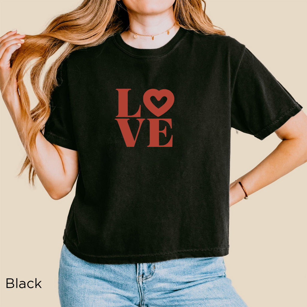 Woman wearing Black Comfort Colors boxy T-shirt with romantic terracotta LOVE graphic