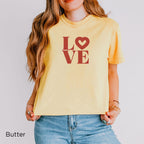 Women’s Butter yellow LOVE heart graphic T-shirt with terracotta LO♡VE design