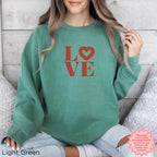 Relaxed women's crewneck sweatshirt featuring a romantic LO♡VE graphic
