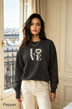 Coastal-inspired women's graphic sweatshirt with cream LOVE design