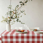 Red and white gingham tablecloth creating a warm, traditional setting for Christmas dinner and family gatherings.