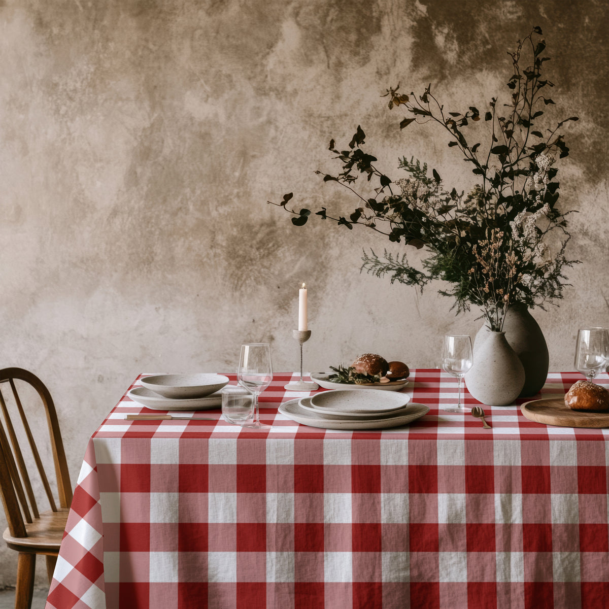 Large red and white gingham tablecloth draped over a dining table, adding timeless charm to the home.