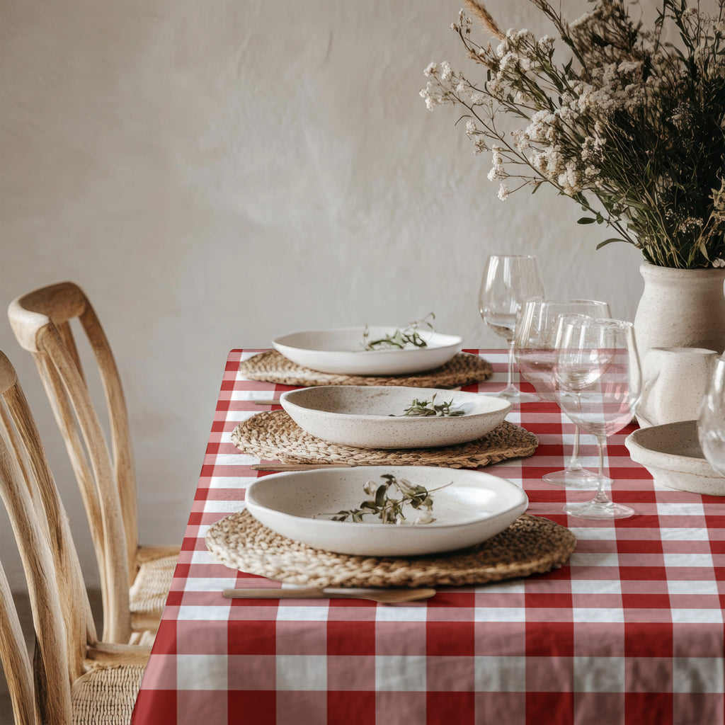 Red checked cotton tablecloth styled for a relaxed lunch or celebration with family and friends.