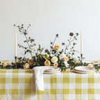 Close-up of the yellow and white gingham check pattern on the 100% cotton twill tablecloth.