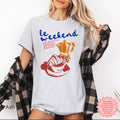 Casual vintage coffee and croissant graphic tee for women, soft cotton fabric.