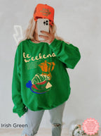 Relaxed crewneck sweatshirt with a colorful coffee and croissant design.