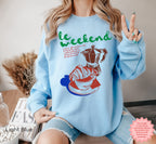 Cozy sweatshirt featuring French-inspired coffee and croissant graphic, perfect for weekends.