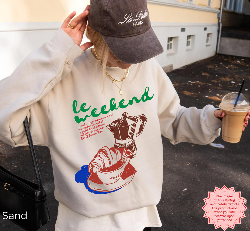Cozy sweatshirt with a colorful coffee and croissant design, ideal for casual weekend wear.