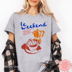 Retro-style coffee and croissant graphic tee, a must-have for coffee lovers and casual wear.