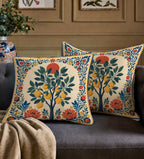 Decorative lemon tree accent pillow featuring artisan-inspired floral borders and warm Mediterranean colour palette.