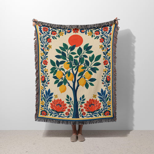 Amalfi Lemon Tree Woven Blanket featuring a Mediterranean lemon design with green leaves, floral details, and colorful fringed edges