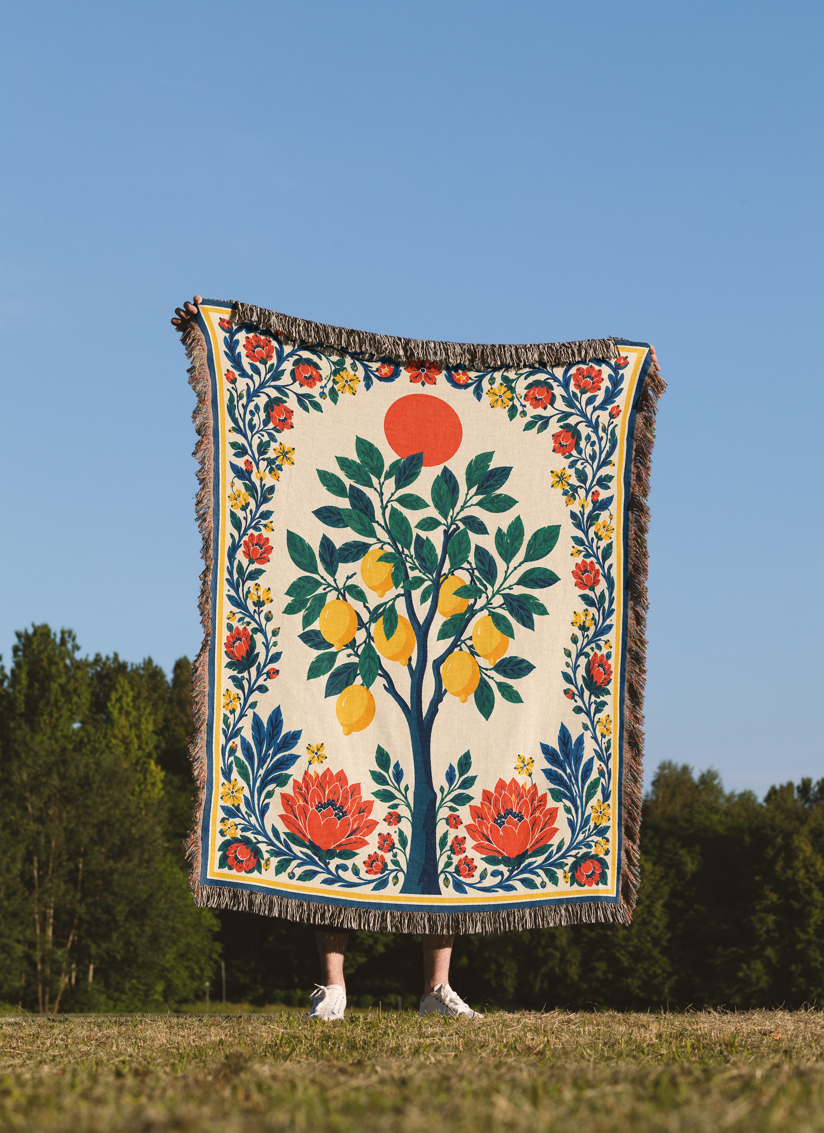 Mediterranean woven blanket with lemon tree artwork, lush green foliage, and elegant floral border design