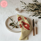 Lobster cotton twill cloth napkin with embroidered lobster design displayed on elegant dining table setting with coastal decor