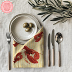 Yellow gingham lobster dinner napkin made from 100% cotton twill with hemmed edges for stylish table decoration