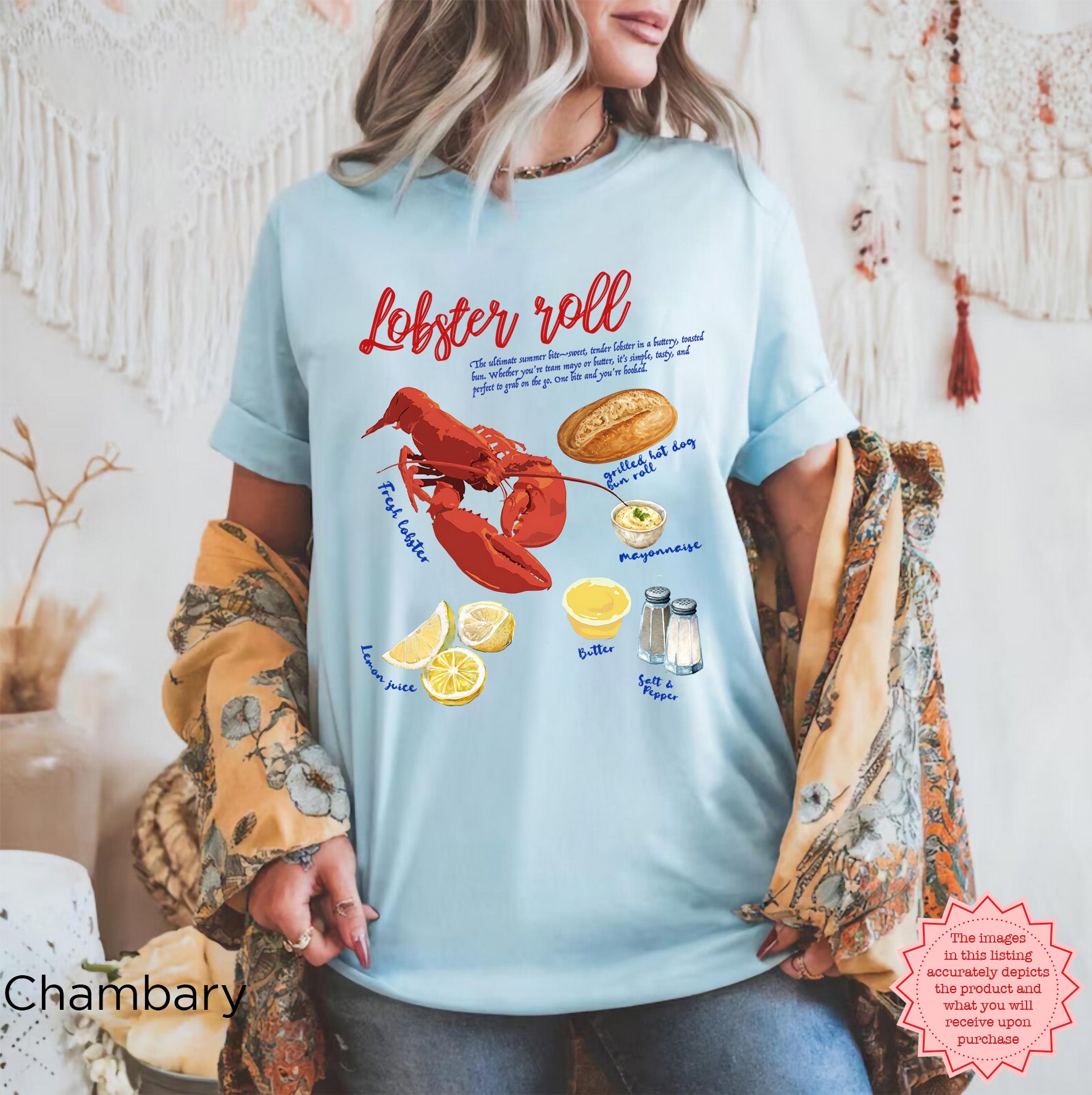 Unisex Comfort Colors 1717 t-shirt in Chambray blue with lobster roll graphic showing fresh lobster, bun, lemon juice, and condiments, styled with casual coastal outfit.