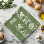 Mediterranean inspired cotton tea towel displayed on kitchen hook