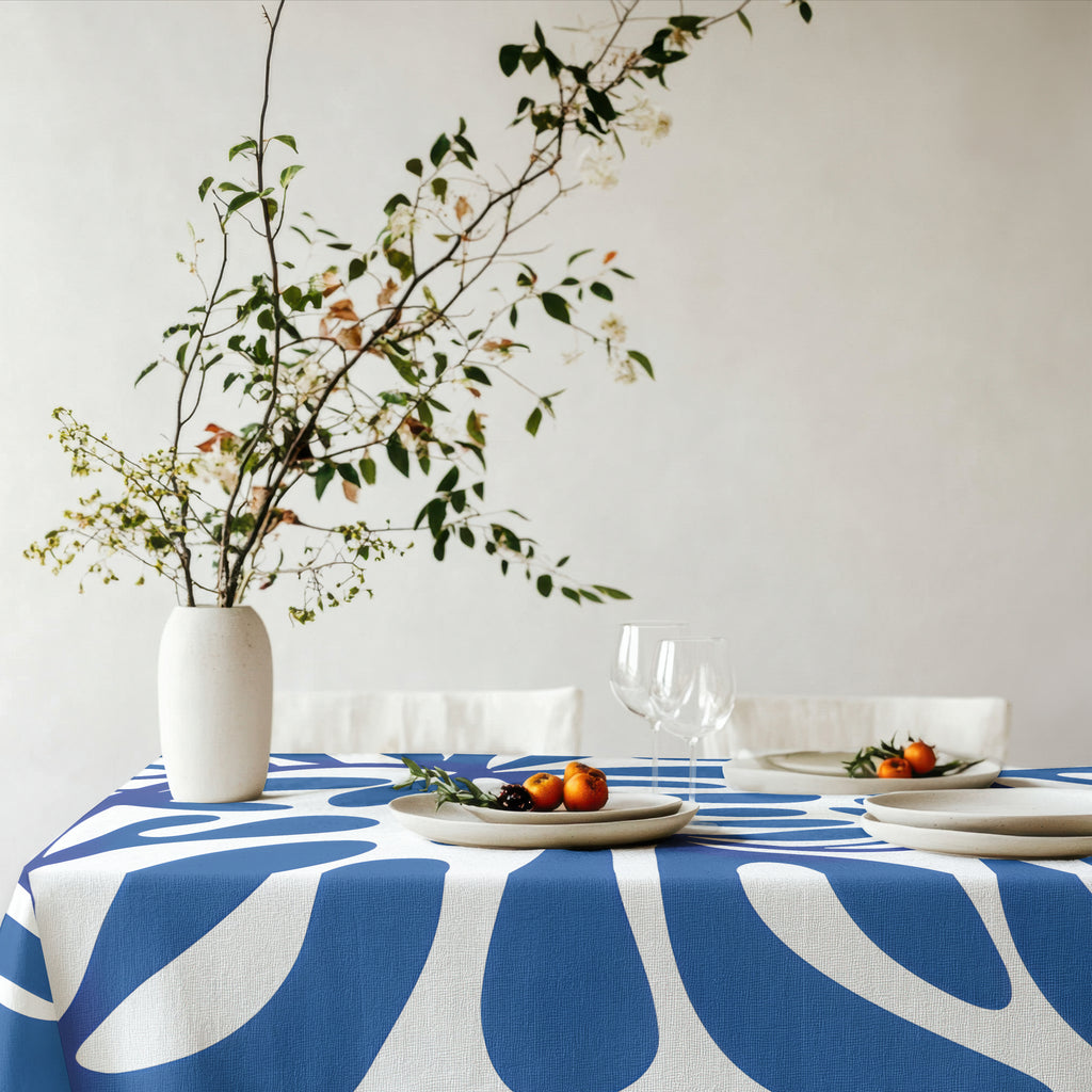Designer-inspired blue and white table linen with bold organic abstract pattern