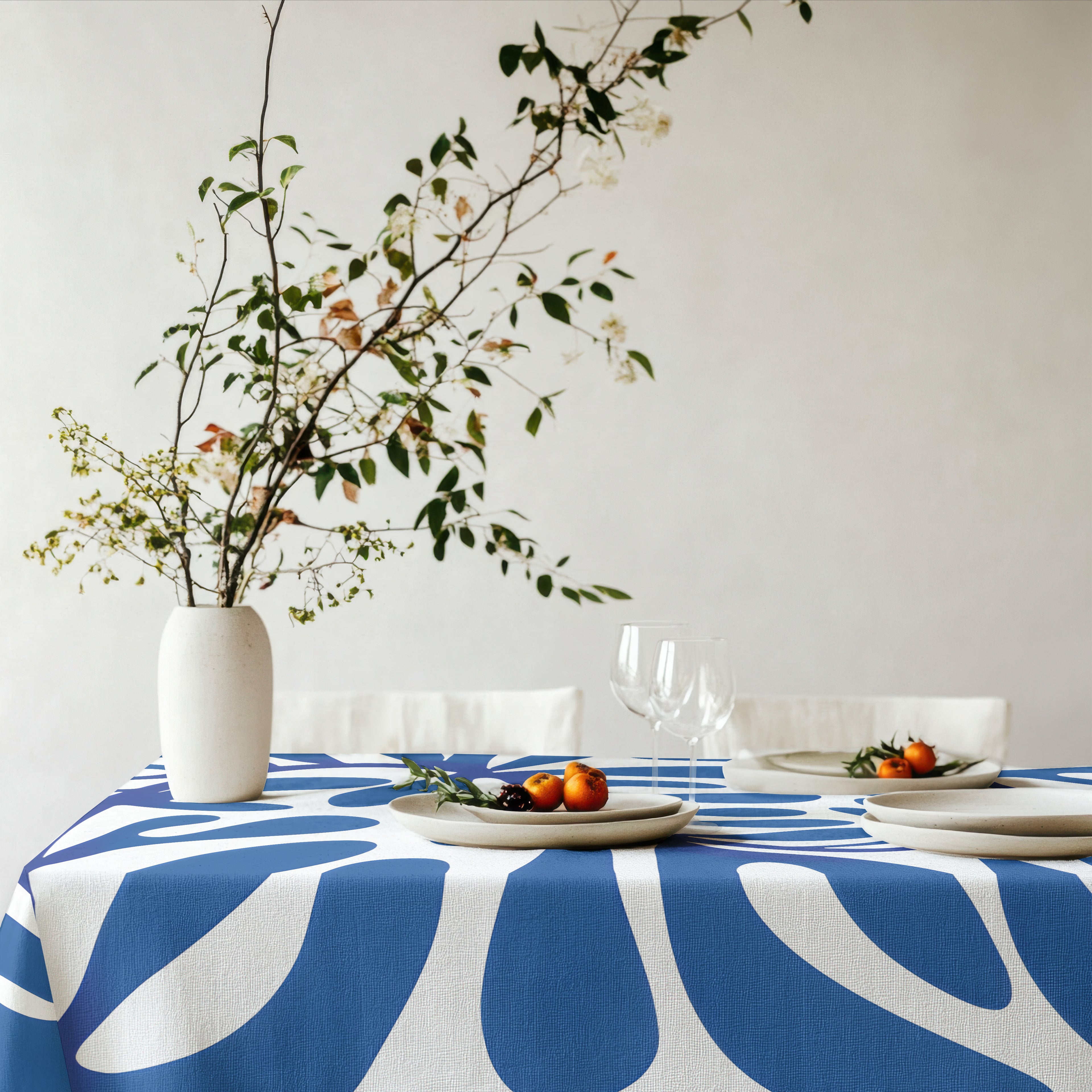 Designer-inspired blue and white table linen with bold organic abstract pattern