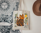 Mediterranean lifestyle tote bag featuring a colorful Matisse-inspired cat surrounded by olives, lemons, and traditional tile motifs.