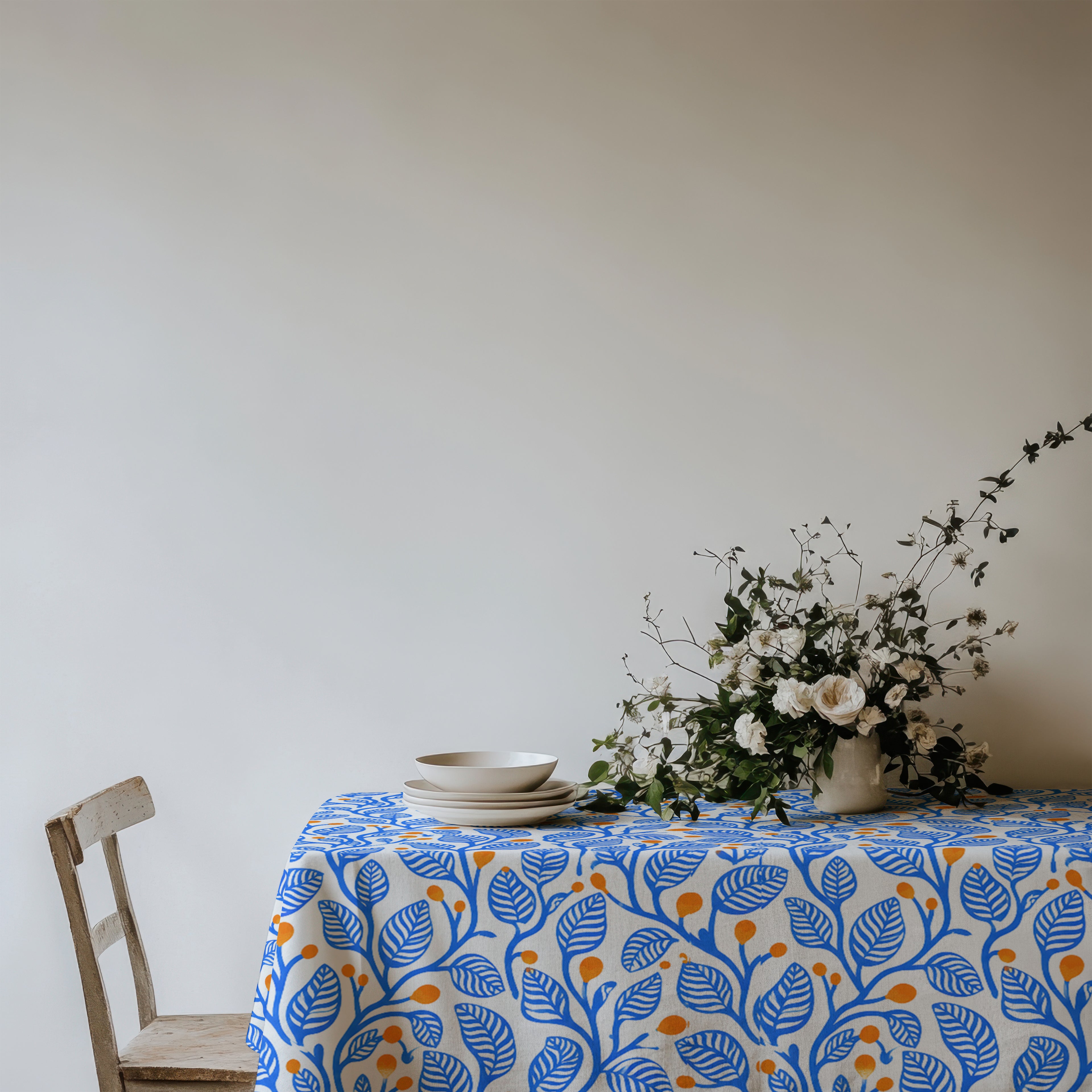 Abstract Mediterranean botanical pattern with cobalt blue foliage and terracotta accents printed on premium cotton twill.