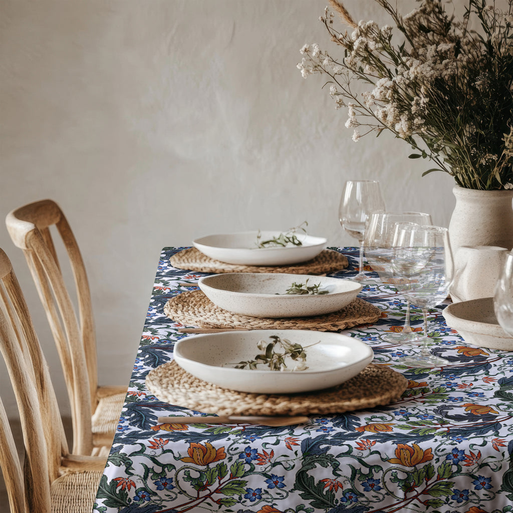 Close-up of Mediterranean-inspired botanical and floral print on soft cotton twill table linen.