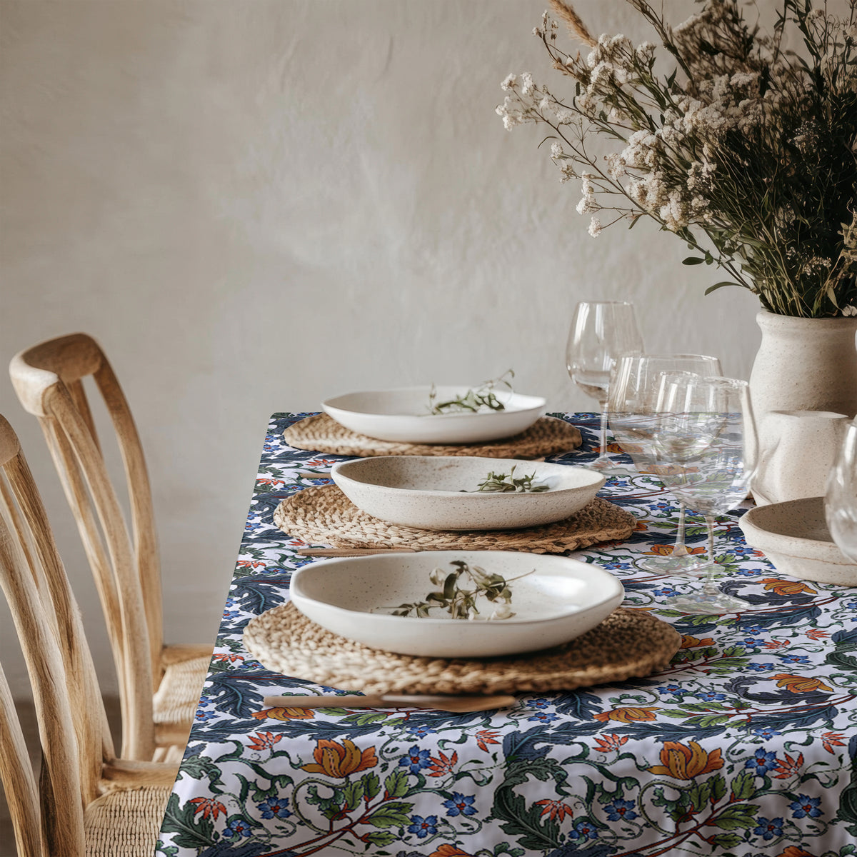 Close-up of Mediterranean-inspired botanical and floral print on soft cotton twill table linen.