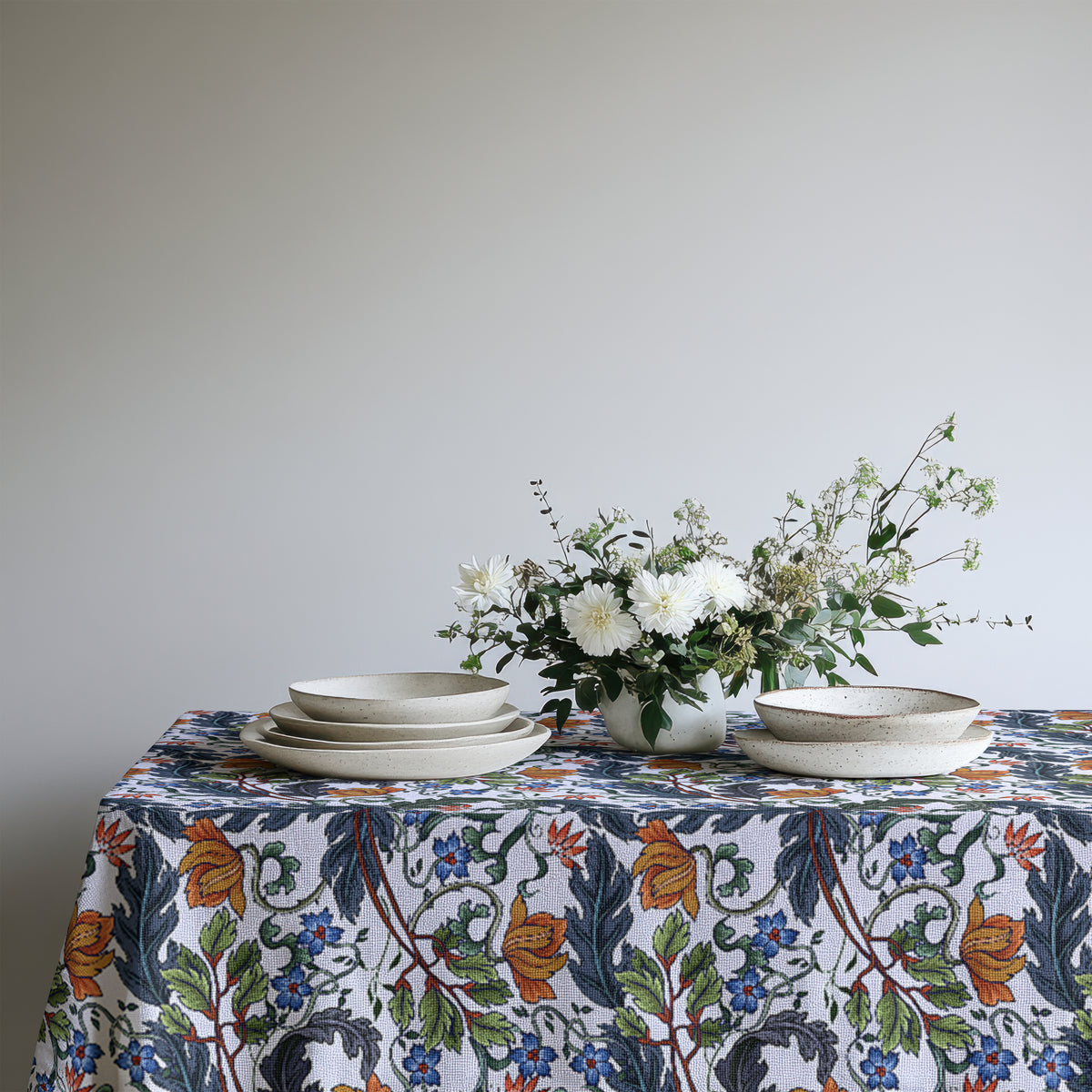 Close-up showing the woven cotton twill texture beneath the botanical floral print.