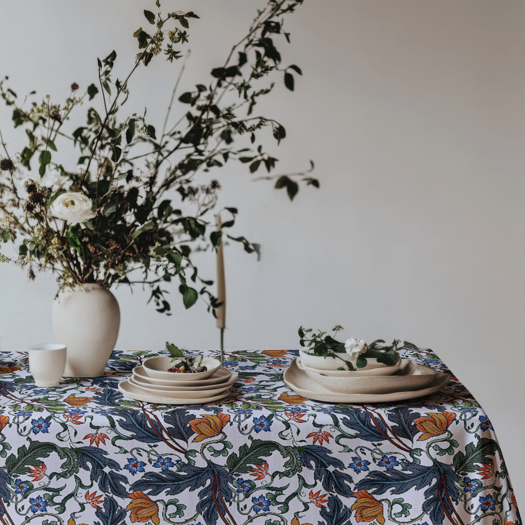 Cotton twill tablecloth featuring elegant leaves, stems, and modern Mediterranean-inspired flowers.