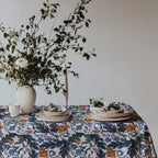 Cotton twill tablecloth featuring elegant leaves, stems, and modern Mediterranean-inspired flowers.
