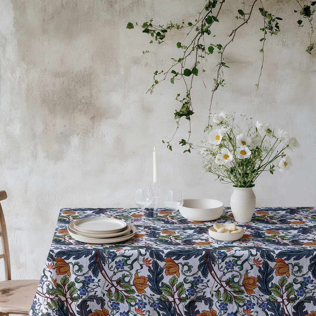 Mediterranean botanical tablecloth with modern floral pattern in rich natural tones on cotton twill fabric.