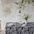 Mediterranean botanical tablecloth with modern floral pattern in rich natural tones on cotton twill fabric.