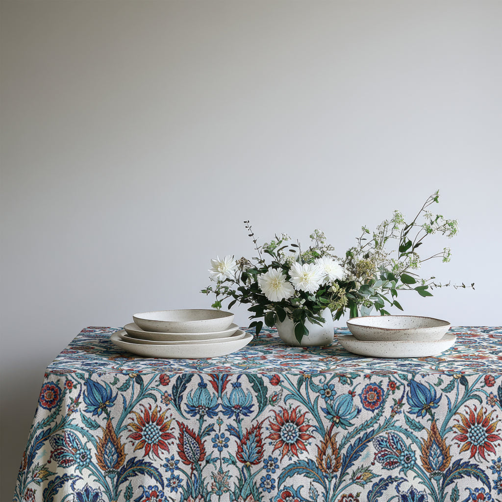 Mediterranean floral table linen with white ceramics, woven placemats and natural table décor