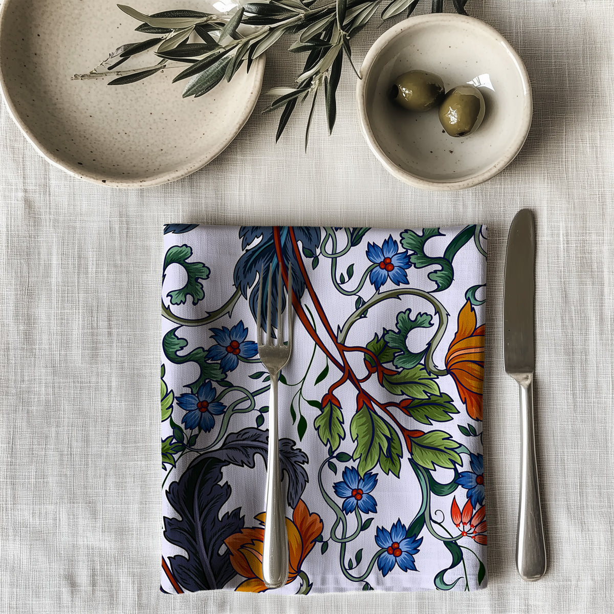 100% cotton twill table napkin featuring a Mediterranean botanical print